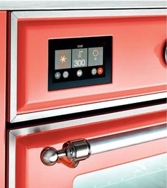 an orange oven with the timer on it's door and knobs toggle