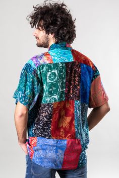 This patchwork shirt is the life of the party, and so are you. The brilliant bohemian radiance of this one-of-a-kind Hawaiian shirt is sure to turn heads and stoke the fires of individuality. Made from individual patches of handcrafted batik fabric from Indonesia complimented by bamboo buttons, each one of these shirts is UNIQUE and colors and patterns WILL DIFFER to reflect the interconnected and often varying nature of the universe. The result is the only shirt in the world that is as unique a Cheap Cotton Patchwork T-shirt, Affordable Multicolor Patchwork T-shirt, Bohemian Multicolor Button-up Shirt, Cotton Patchwork Button-up Shirt, Magic Skirt, Multicolor Printed Button-up Hawaiian Shirt, Colorful Vibes, Scorpio Gifts, Sagittarius Gifts