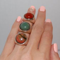 This is a ring made to fit everyone, on any occasion. It would be ideal for a graduation, an anniversary or just to wear it on an everyday basis.  The stones of choice are - Green agate - Jasper - Two-colored agate The ring is inspired, designed and made by Kreitto design team. All Kreitto jewels are handmade in our workshop in Athens, Greece (with attention to detail as always) using: Sterling silver (stamped 925) recycled Hand picked Agate stones. An ideal ring to match your style or a perfect gift. We can engrave on the ring the year of your graduation. Send us convo for details. Please let us know your ring size before check out! You can find your size here https://kreitto.gr/wp-content/uploads/2020/02/2017-kreitto-ring-sizer-1.pdf Follow us at: https://www.instagram.com/kreitto_design Unique Adjustable Rings With Natural Stones, Round Gemstone Midi Rings As Gift, Adjustable Stackable Rings With Stones, Elegant Stackable Rings With Stones As Gift, Adjustable Open Ring With Natural Stones, Unique Adjustable Dome Ring As A Gift, Modern Crystal Ring With Round Band, Silver Emerald Ring With Natural Stones, Formal Natural Stones Gemstone Ring