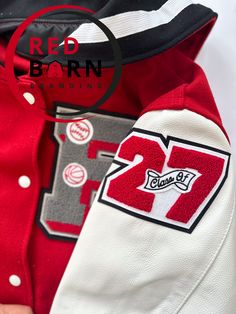 a red and white jacket with the number twenty seven on it's left chest