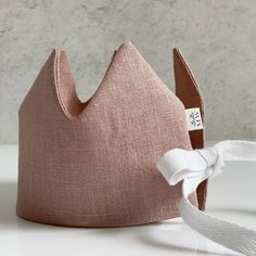 Birthdays, Imaginary Play, or just because you're feeling extra royal, Linen Play Crowns add a bit of magic to your everyday. Handcrafted from Oeko-Tex Certified Linen with a layer of natural cotton batting for stability, these fabric crowns are available in your preferred color choice for pretend play. Madly Wish Linen Play Crowns are finished with a twill tie. FEATURES * One size fits most * 100% pure European and Oeko-Tex Certified linen * Made in the USA from imported textiles Made in United Fabric Crowns, Vintage Airplane Nursery, Boppy Lounger, Fabric Crown, Boppy Cover, Handmade Stuffed Animals, Imaginary Play, Nursing Pillow Cover, Fiber Jewelry