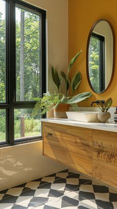 a bathroom with yellow walls and checkered flooring, two round mirrors on the wall