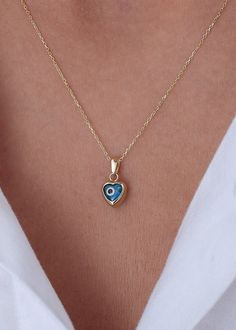 Ready to Ship 1-3 Business Days  Evil Eye Blue Necklace in 14k Solid Gold * Heart Evil Eye Pendant-Blue Heart Necklace Handmade item Materials: Gold, Rose gold, White gold Made to Order Pendant height: 7 mm/0.28 ınches Pendant width: 7 mm/0.28 ınches Pendant thickness:4.5 mm /0.18 ınches P R O D U C T ∙ F E A T U R E S * Gold material: 14k solid gold * Gold color options: Yellow gold, Rose gold, White gold * Choice of chain length: 14, 16, 18, 20, Pendant Only  We carefully produce our 14k real Blue Heart Cut Necklace For Anniversary, Blue Birthstone Necklace As Gift For Her, Blue Heart Cut Necklace For Wedding, Heart-shaped Blue Jewelry For Anniversary, Blue Heart-shaped Jewelry For Anniversary, Elegant Blue Jewelry With Heart Beads, Blue Necklace For Anniversary On Valentine's Day, Blue Birthstone Charm Necklaces As Gift, Blue Birthstone Gold-plated Jewelry