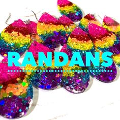 colorful earrings with the words randy's on it in blue and pink glitters