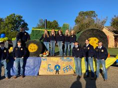 a group of young people standing on top of a float