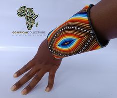 Our Hand Bracelet is a stunning work of art, hand-stitched from fine leather and adorned with exquisite bead art decoration. It's durable, adjustable, and versatile, making it the perfect accessory for any occasion. A symbol of beauty and elegance, it's sure to enhance any outfit and turn heads wherever you go. Don't settle for a boring bracelet - choose the Hand Bracelet and make a bold statement with your fashion choices. Order now and experience the ultimate expression of style, elegance, and individuality. Multicolor Leather Beaded Bracelets Handmade, Multicolor Beaded Leather Bracelets, Adjustable Multicolor Leather Beaded Bracelet, Artisan Beaded Adjustable Cuff Bracelet, Hand-stitched Adjustable Bohemian Jewelry, Artisan Hand-stitched Adjustable Jewelry, Adjustable Multicolor Leather Bracelet With Colorful Beads, Bohemian Leather Bracelet With Beads, Unique Adjustable Bracelet Wristlet