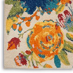 an area rug with colorful flowers on it