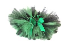 a green and black tutule with a bow on it