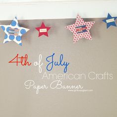 the fourth of july american crafts paper banner is hanging on the wall with red, white and blue stars