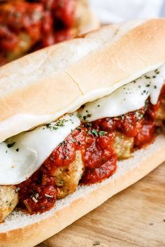 a meatball sub sandwich with tomato sauce and cheese