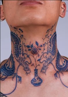 a man with a dragon tattoo on his neck