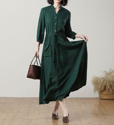 This gorgeous blackish green long-sleeved dress is made of high-quality linen fabric that drapes beautifully on the body. The V-neckline adds a touch of elegance, while the drawstring waist allows you to adjust the fit to your liking. Perfect for any occasion, whether you're going to work or a special event. ★★FEATURES Linen 100% Two front pockets Long sleeve Pleated waist details Drawstring waist Front button closure Maxi linen dress Casual linen dress Long linen dress Plus size dress Simple dr Dark Green Long Sleeve Midi Dress For Spring, Elegant Dark Green Long Sleeve Maxi Dress, Fall Long Sleeve Linen Dress, Long Sleeve Linen Midi Dress With Buttons, Linen Midi Dress With Long Sleeves And Buttons, Linen Midi Dress With Buttons And Long Sleeves, Green Linen Dresses For Fall, Green Linen Dress For Fall, Long Sleeve Linen Midi Dress For Fall