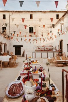 a long table covered with food and bunting