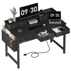 a computer desk with two clocks on it and an open drawer underneath the desk top