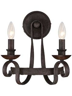 an iron chandelier with three lights on it