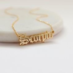 Beautiful and lovely Zodiac sign necklace made of gold plated Scorpio scrip pendent with skinny gold chain. Soft and warm and great for gift items.  Your necklace will ship in a gift box. If you have any questions, please feel free to contact me. Thanks :)    * Chain length 14" - 20"  * Pendant 3/8" x 1 1/4"  * Gold plated brass  * Zodiac Jewelry Birthday Jewelry Astrology Zodiac necklace  Scorpio  (Oct 23 - Nov 21)  * Delivery Time Fast shipping within 1 - 3 days  * See more Rudiana Accessories + www.Rudiana.etsy.com Gold Zodiac Sign Necklaces For Birthday, Gold Zodiac Sign Necklaces For Birthdays, Gold Zodiac Sign Charm Necklace As Gift, Gold Zodiac Sign Charm Necklace For Gift, Gold Charm Necklace With Zodiac Sign For Gift, Zodiac Necklace Scorpio, Scorpio Necklace, November Birthday Gifts, Script Necklace