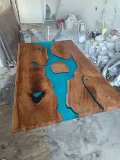 a wooden table with blue paint on it