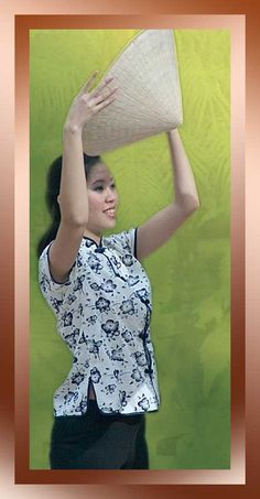 a woman holding a large bag over her head