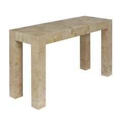 a white marble table with two legs and a long wooden slab at the top, on a white background