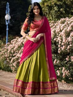 Introducing our stunning "excellent green zari weaving kanchipuram silk event wear lehenga choli" that is sure to make you stand out at any special occasion. This set includes a green color Kanchipuram silk lehenga with intricate zari weaving work, a pink color Kanchipuram silk choli also with zari weaving work, and a pink color georgette plain dupatta with lace border work.
The green lehenga is beautifully stitched up to 42 inches, with a 3.70-meter flair, and un-stitched choli material of 0.80 Kerala Dhavani Set, Half Saree Designs South Indian, Kanchipuram Lehenga, Silk Half Saree, Onam Outfits, Lehenga Choli Designs, Simple Lehenga, Half Saree Lehenga, Stitched Lehenga