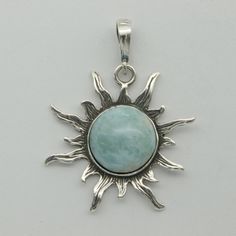 This is a beautiful Larimar Pendant in 925 Sterling Silver. The Larimar is from the Dominican Republic and is not treated in any way. There is also no nickel or other substances causing most allergies in the silver making the pendant hypo allergenic.  Size of the Pendant (incl. Bail) 3.6 x 2.7 cm 1.42 x 1.06 inch You will receive the item in a gift box - perfect to surprise someone or yourself. Usually we ship on the same day we receive the payment for the order. We want you to be happy with your purchase. If you do not like what you bough can send it back and we will refund you the money. Please do not hesitate to contact us so we can solve any issue you might have. Nothing is more important than a happy customer. Silver Larimar Pendant Jewelry, Silver Larimar Jewelry For Healing, Handmade Silver Larimar Jewelry, Handmade Silver Jewelry With Larimar, Hallmarked Larimar Jewelry, Spiritual Larimar Pendant Jewelry, Spiritual Round Larimar Jewelry, Nickel-free Larimar Silver Jewelry, Larimar Pendant