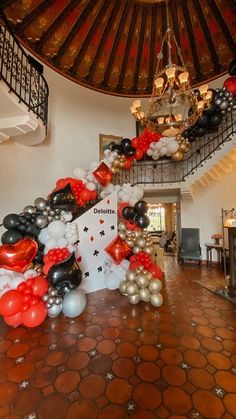 a staircase decorated with balloons and streamers