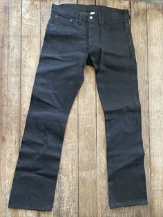 This pair of men's RRL Double RL jeans is a must-have for any denim enthusiast. Made from 100% cotton with a shuttle woven accent, these slim-fit jeans feature a button fly closure and a medium fabric wash. The selvedge detailing adds a touch of style to the classic blue denim color. With a waist size of 29 and an inseam of 32, these jeans have a regular size type and are made in the United States. The RRL product line ensures top-notch quality and durability that is sure to last. Add these jeans to your wardrobe for a timeless and versatile look. Rugged Straight Leg Pre-washed Bottoms, Rugged Pre-washed Cotton Jeans, Rugged Straight Leg Pre-washed Jeans, Dark Wash Straight Fit Cotton Pants, Rugged Cotton Jeans With Standard Cut, Rugged Cotton Jeans With Belt Loops, Pre-washed Straight Leg Cotton Pants, Pre-washed Cotton Straight Leg Pants, Fitted Pre-washed Cotton Bottoms