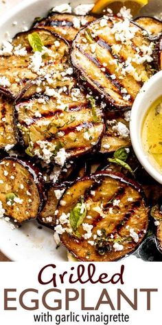 grilled eggplant with garlic and parmesan cheese on a white plate