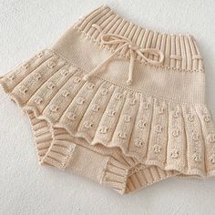 the shorts are knitted and have ruffles on them, as well as lace