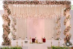 a wedding ceremony setup with flowers and candles