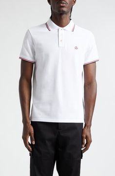 Classic tipping at the collar and cuffs enhances the sporty look of this cotton-piqué polo detailed with Moncler's signature cockerel logo at the chest. Button half-placket Rib collar Short sleeves with rib cuffs 100% cotton Dry clean or hand wash, dry flat Imported Designer Clothing Classic White Polo Shirt With Contrast Collar, Luxury Polo Shirt With Contrast Collar, White Sporty Polo Shirt With Contrast Collar, White Polo Shirt With Contrast Trim, White Polo Shirt With Striped Collar For Workwear, White Collared Polo Shirt With Contrast Trim, Classic Collared Polo Shirt With Logo Detail, White Cotton Polo Shirt With Contrast Trim, Luxury Fitted White Polo Shirt