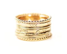 Unleash your wild and adventurous spirit with our Wanderlust Stacking Rings, meticulously handcrafted by our talented artisans to embody dynamic energy and movement. Handcrafted from .925 Sterling Silver or 14kt Yellow Gold Filled, these rings feature captivating patterns and textures, ensuring a truly unique and exhilarating stack. Custom-made to order, you have the freedom to curate your ideal combination. Choose from a selection of fine metals and styles, and watch as your stack takes shape, Adjustable Etched 14k Gold Jewelry, Adjustable 14k Gold Etched Jewelry, Adjustable Yellow Gold Jewelry With Decorative Band, Bohemian 14k Yellow Gold Rings, Bohemian Gold Stackable Sterling Silver Rings, Bohemian Gold Stackable Rings In Sterling Silver, Symbolic Stackable Adjustable Jewelry, Adjustable 14k Gold Bohemian Jewelry, Adjustable Bohemian 14k Gold Jewelry