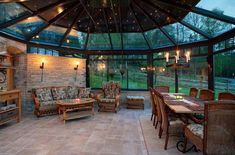 the inside of a house with lots of furniture and lights on it's ceiling