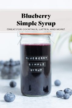 blueberry simple syrup in a glass jar with berries around it and text overlay that reads, blueberry simple syrup great for cocktails, lattes, and more