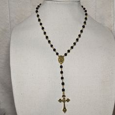 Gold Rosary Necklace With Cross Charm. Measures 18" Inches Around And Is Made With Black Glass Beads, A Lobster Clasp And 1.5 Inch Extension Chain. Like This Style But Want A Different Charm? Send Me A Message! Black Single Strand Necklace For Gift, Nickel-free Black Beaded Necklace As Gift, Nickel-free Black Beaded Necklace For Gift, Nickel-free Black Beaded Necklace, Nickel-free Black Beaded Necklace Gift, Black Beaded Necklace With Adjustable Chain As Gift, Nickel Free Black Beaded Necklaces, Nickel-free Black Beaded Necklaces With Round Beads, Spiritual Single Strand Black Jewelry