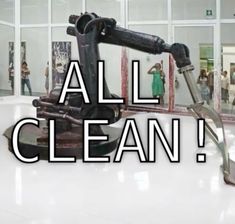 an image of a robot cleaning the floor in a building with words that read, all clean