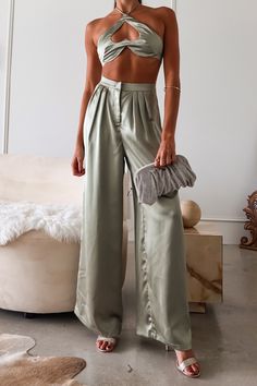 Sage green satin pant set Top ties around neck Bra top with underwire and heart hole cut out Elastic stretchy backing for comfortable fit Pleated wide leg trousers Zipper clip closure Top Lined/Bottom Non Lined Non stretch Runs true to size, Sofia wears size small Polyester, Hand wash cold Paired with the Layla Metal Clutch Sofia's measurements - Height 5'8, Bust 32B, Waist 27 in , Hips 34 in. She normally wears a size small in tops, a size 2 in dresses, and a size 3/25 in jeans. FINAL SALE Satin Set Outfit, Satin Pant, Satin Set, Satin Pants, Design Clothes, Green Satin, Satin Material, Fashion Design Clothes, Set Outfit