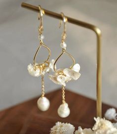 Made of natural freshwater petal pearls, exude elegance and boast a delightful luster. They are perfect for pairing with dresses or for wearing on formal occasions. P E A R L ∙ E A R R I N G S Total length: about 7cm  Pearl: Handpicked High Luster  petal pearls  about：8-10mm  Setting : 14k Gold-filled Hook (100% nickel free, great for sensitive ears) O T H E R ∙ I N F O R M A T I O N ✨ Our pieces are made with care and attention to details. ✨Freshwater pearls are entirely natural, which means that each one has its own distinct size and shape. I'll take care to ensure that the pearls harmonize beautifully with each other. ✨ The orders typically take 1-3 days to process.  ✨ Your satisfaction is always my priority. Please feel free to contact me if you have any questions or requests regarding Pearl Chain Hoop Earrings For Wedding, Wedding Earrings With Pearl Charm And Mother Of Pearl, Wedding Mother Of Pearl Earrings With Pearl Charm, Elegant Hoop Earrings With Pearl Chain For Wedding, Delicate Baroque Pearl White Earrings, Elegant Pearl Chain Hoop Earrings For Wedding, Elegant Flower-shaped Hoop Earrings Gift, Elegant Flower-shaped Hoop Earrings For Anniversary, Elegant Flower-shaped Hoop Earrings For Wedding