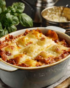 a casserole dish filled with meat and cheese