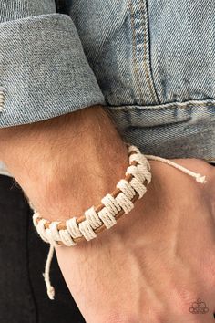 Sections of rustic white cording interweave and knot around three rows of brown leather cords, creating an earthy checkered pattern around the wrist. Features an adjustable sliding knot closure. Adjustable Sliding Knot, Paracord Bracelet Tutorial, Sliding Knot Closure, Diy Leather Bracelet, Brown Bracelet, Cord Jewelry, Sliding Knot, Rustic White, Paracord Bracelets