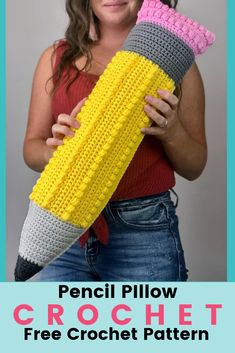 a woman holding a crochet corn cob with text overlay that reads, pencil pillow crochet free crochet pattern