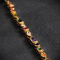 A chain with an incredible personality. It has been made with a stainless steel, plated in 18k gold, but the most amazing thing about its design are the gems that run throughout the chain, giving it not only shine but also a unique and perfect appearance to give a different look to your style. Elegant Multicolor Gold Plated Bracelets, Multicolor Gold Plated Bracelet, Multicolor Multi-stone 14k Gold Bracelets, Elegant Rainbow Multi-stone Bracelets, 14k Gold Multi-stone Rainbow Jewelry, Dream Jewelry, 18k Gold, Gold Plate, Ring Size