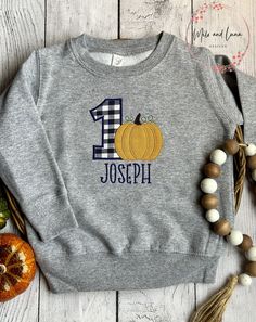 Boys First Birthday Fall Pumpkin Shirt and Sweatshirt, Pumpkin Birthday Welcome Fall with this adorable Boys Pumpkin Birthday design. Choose from Grey Sweatshirt (shown) or Grey T-shirt. Personalize child's name and age.  Sweatshirt and Tshirts run true to size.  T-shirt sizes are 12M, 18M, 2T, 3T, 4T, 5, 6, 8 Sweatshirt sizes are 2T- 3T, 4T, 5/6, 7 **WASHING INSTRUCTIONS** WASH INSIDE OUT COLD WATER WITH LIKE COLORS TUMBLE DRY LOW LOW IRON  NO DRY CLEANING PRODUCTION TIME  Production is 7 busin Fall First Birthday Boy, Boys First Birthday, First Birthday Boy, Pumpkin Birthday, August Birthday, Welcome Fall, Fall Birthday, Low Low, Grey T Shirt