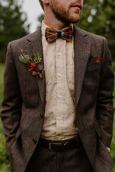 a man wearing a suit and bow tie