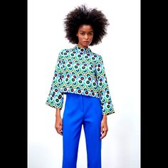 High Collar Top With Wide Long Sleeves. Back Opening With Button Closure. Multicolored | 2666/126 Blue Long Sleeve Top With Geometric Pattern, Modern Blue Blouse For Office, Chic Spring Tops With Geometric Pattern, Blue Tops With Geometric Pattern For Workwear, Modern Blue Tops With Button Closure, Chic Multicolor Tops With Geometric Pattern, Blue Bold Print Long Sleeve Tops, Modern Multicolor Tops For Work, Modern Blue Long Sleeve Blouse