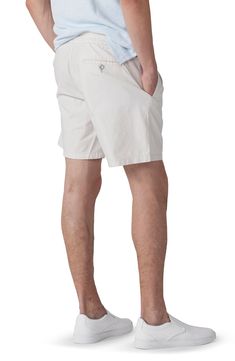 A smocked drawstring waist means a flexible fit in these sun-ready shorts that are made from stretch-enhanced cotton. 7" inseam; 24" leg opening; 12 1/4" front rise; 15" back rise (size Large) 98% cotton, 2% elastane Machine wash, line dry Imported Casual Cotton Swim Trunks With Built-in Shorts, Cotton Swim Trunks With Built-in Shorts, Cotton Shorts For Warm Weather, Relaxed Fit Cotton Shorts For Warm Weather, Cotton Shorts With Elastic Waistband For Warm Weather, Cotton Bottoms With Elastic Waistband For Warm Weather, Warm Weather Cotton Shorts With Elastic Waistband, Bermuda Cotton Swim Trunks For Vacation, Cotton Shorts For Vacation In Warm Weather