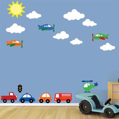 a child's room with cars and planes on the wall