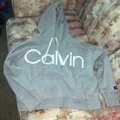 Size Large Grey Calvin Klein Cropped Hoodie With White Strings. Never Worn, Brand New Without Tag. Calvin Klein Winter Sweatshirt With Ribbed Cuffs, Casual Calvin Klein Tops With Ribbed Cuffs, Calvin Klein Casual Tops With Ribbed Cuffs, Calvin Klein Sporty Sweatshirt With Ribbed Cuffs, Comfy Hooded Sweatshirt With Letter Print, Calvin Klein Fall Streetwear Hoodie, Calvin Klein Hooded Hoodie For Fall, Calvin Klein Winter Streetwear Sweatshirt, Calvin Klein Hoodie Sweatshirt For Fall