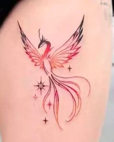 a woman's thigh with a bird tattoo on the side and stars around it