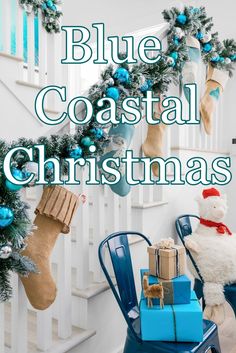 blue coastal christmas decorations with teddy bear sitting on chair next to wreath and stockings hanging from banister